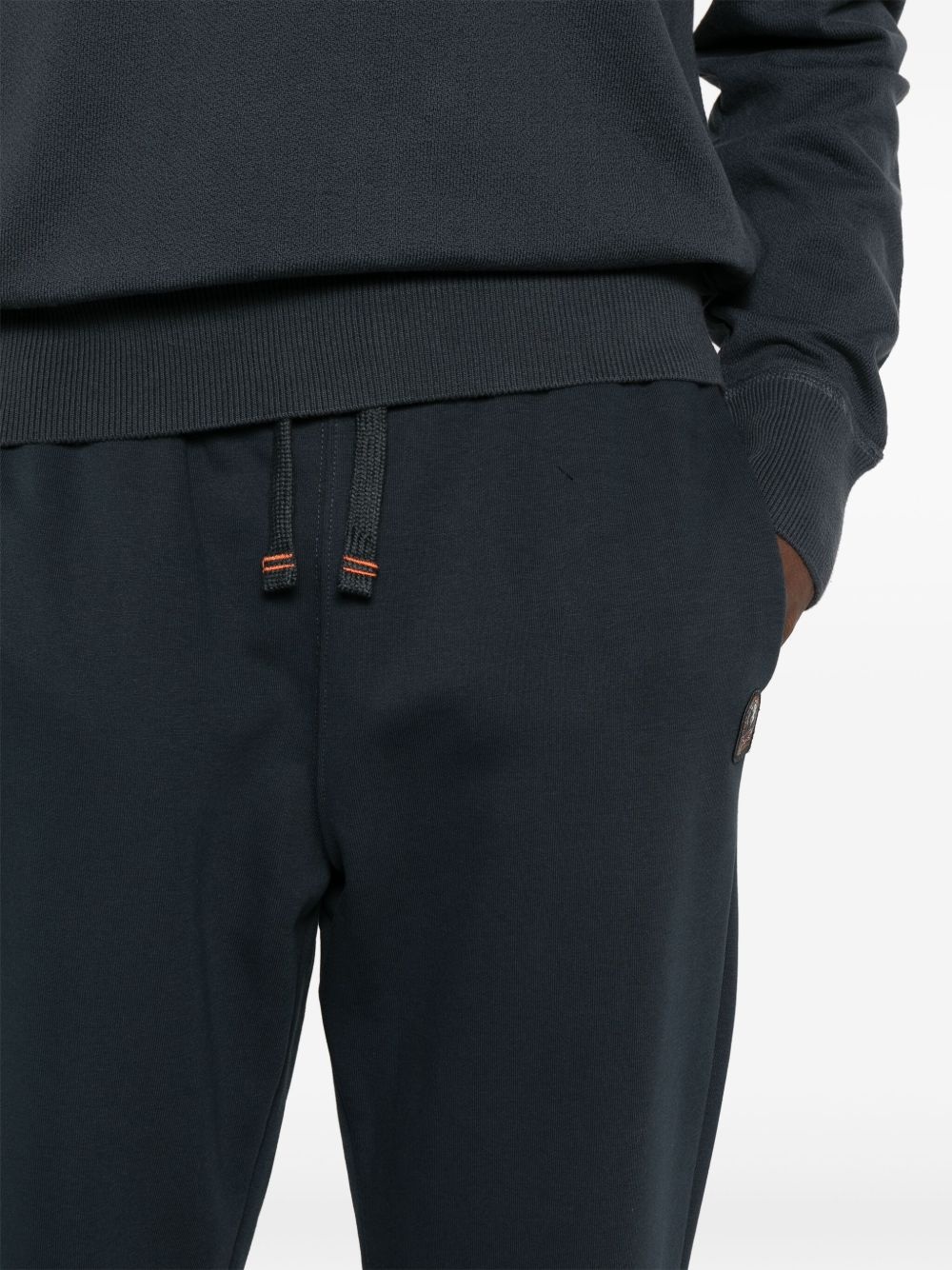 Makalu logo-appliqué tapered trousers - 5