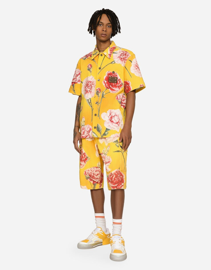 Dolce & Gabbana Denim shorts with all-over carnation print outlook