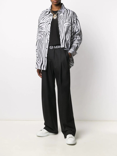 VERSACE logo waistband straight-leg trousers outlook