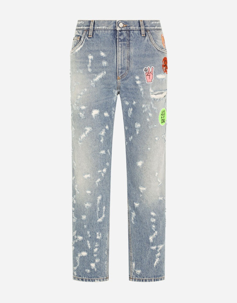 Loose light blue jeans with rips and patch detailing 1