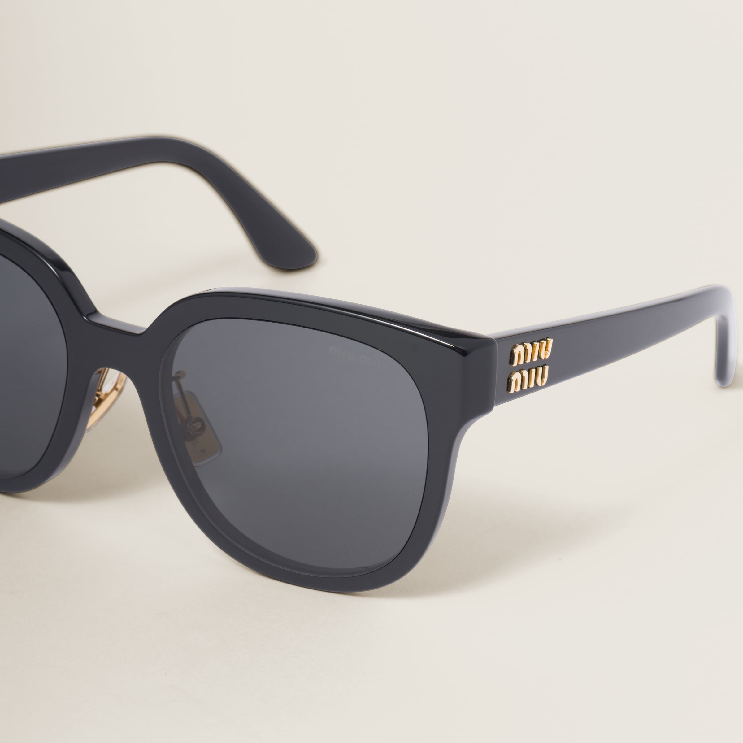 Miu Miu Miu Miu Logo sunglasses | REVERSIBLE
