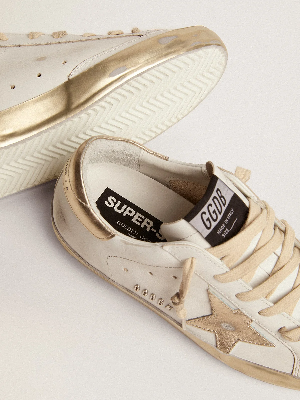 Golden Goose Women's Super-Star sneakers with gold sparkle foxing