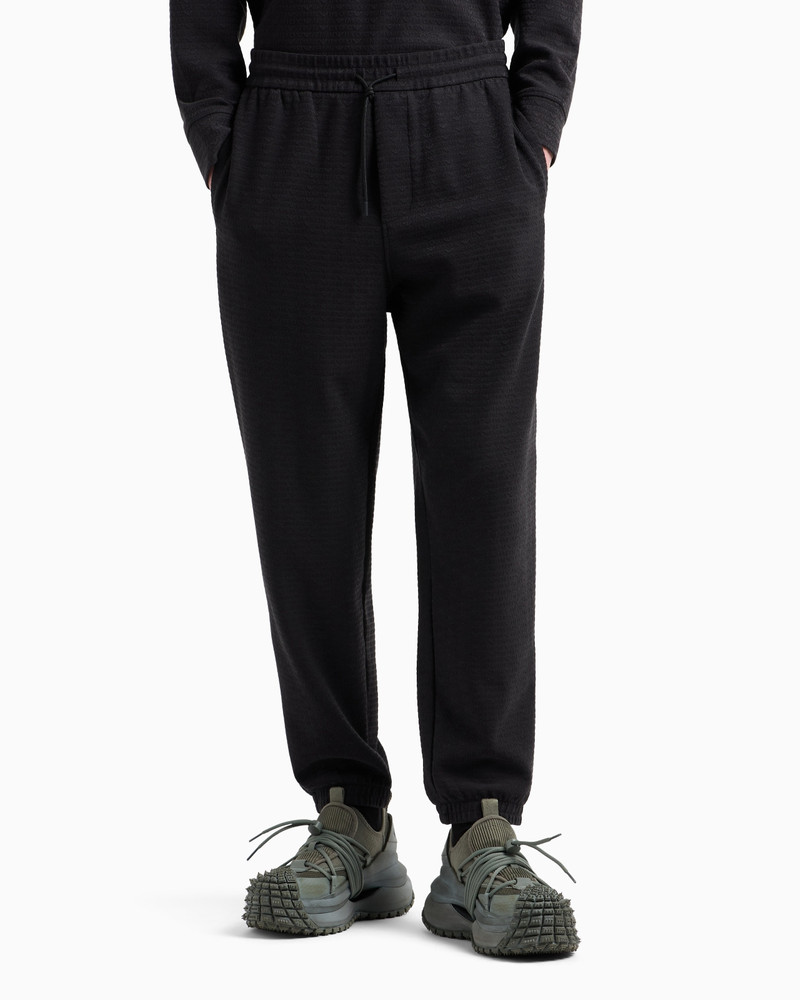 EMPORIO ARMANI ASV LYOCELL BLEND JERSEY JOGGERS WITH ALL-OVER LETTERING outlook