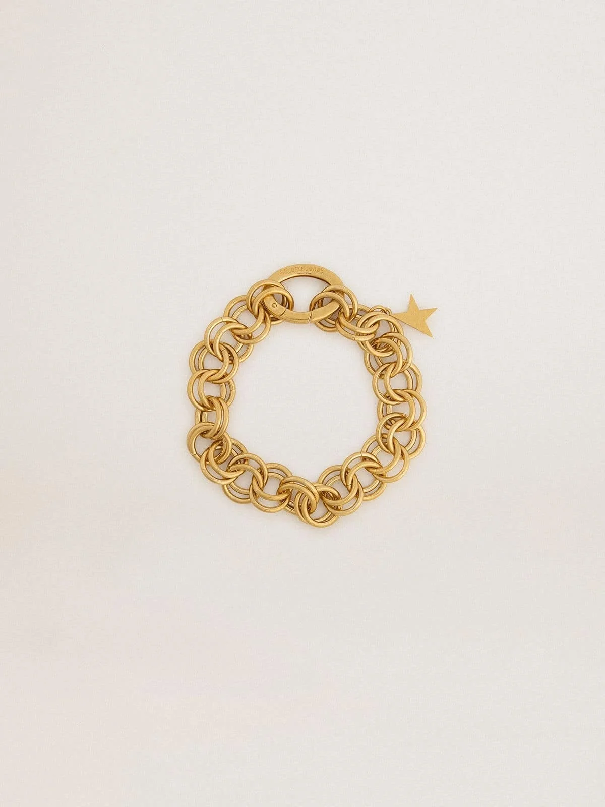Antique gold-colored woven chain bracelet with star-shaped clasp - 1