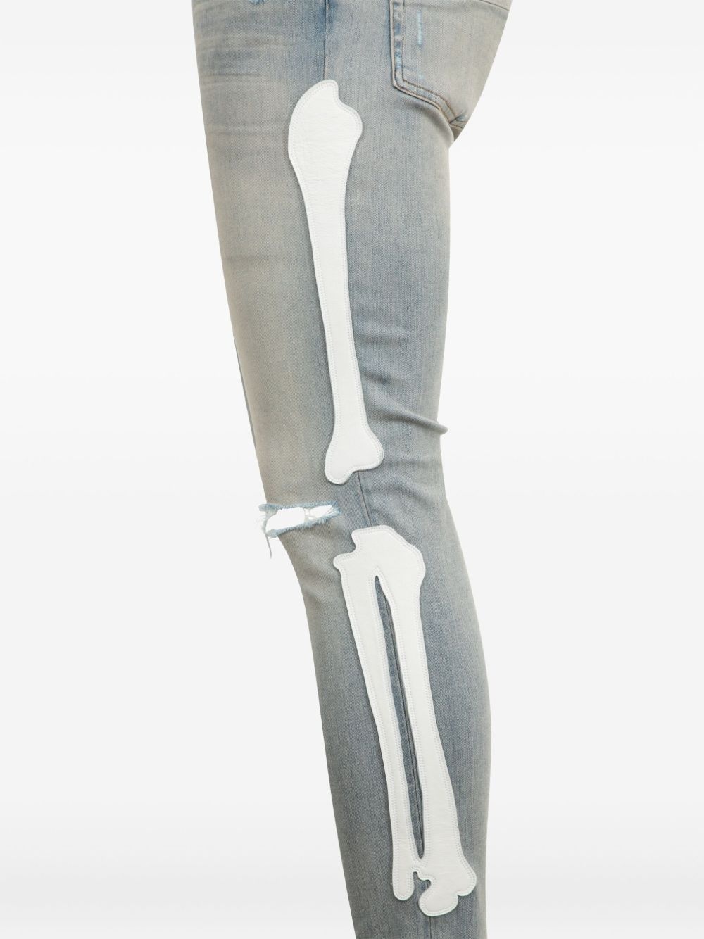 Bones-appliqué distressed skinny jeans - 2