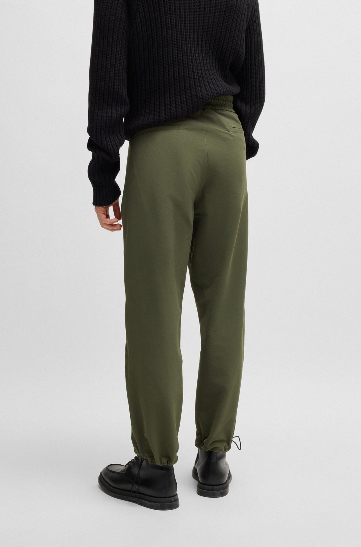 WATER-REPELLENT TROUSERS WITH ADJUSTABLE HEMS - 4
