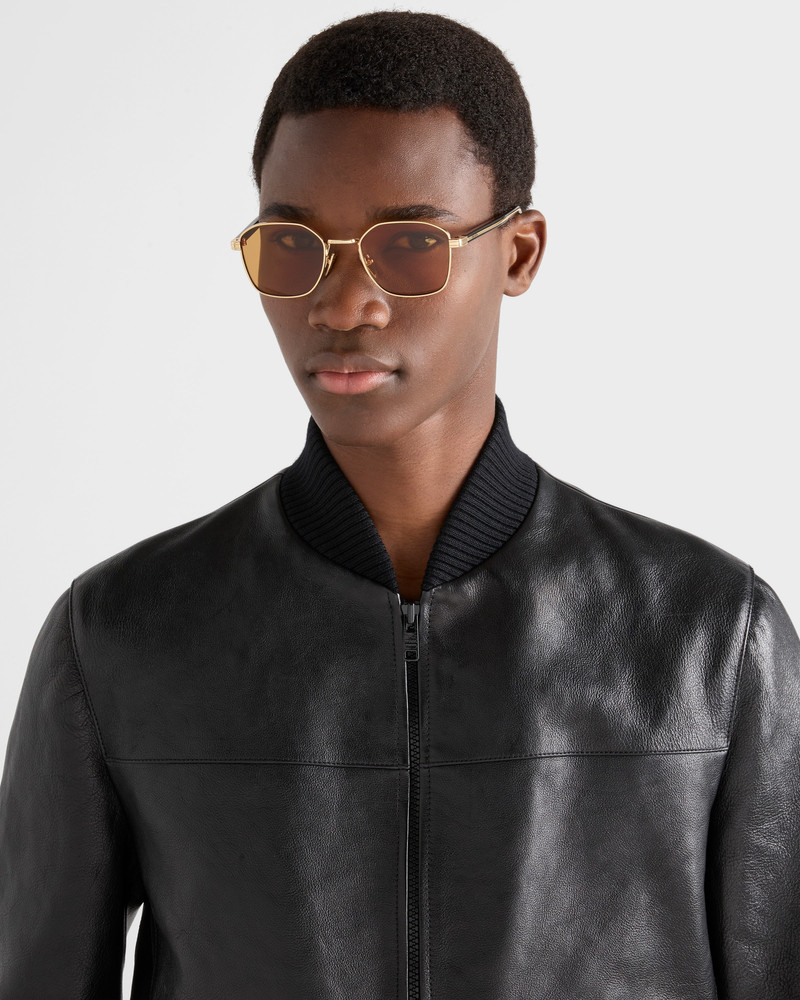 Prada Sunglasses with the iconic metal plaque outlook