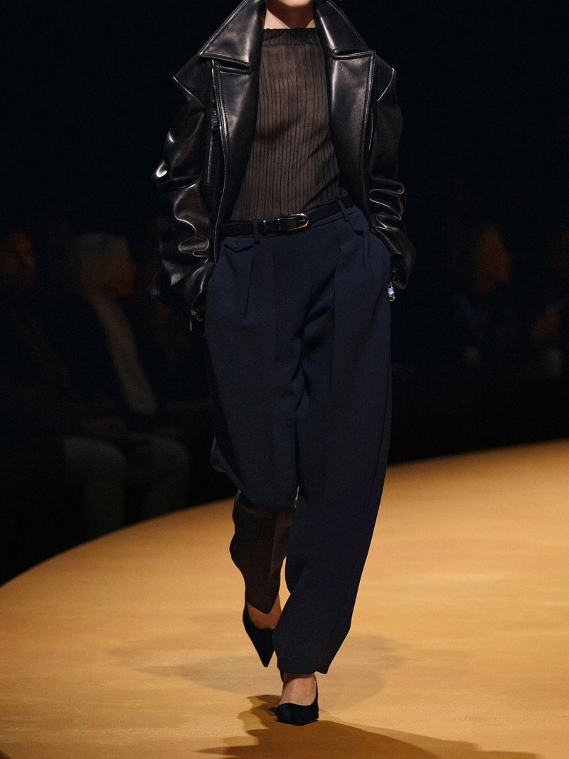 KHAITE Dugan pleated crepe tapered pants Navy outlook