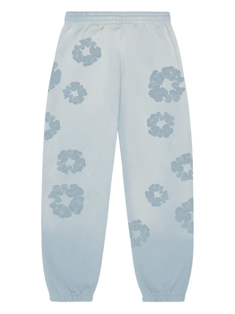 DENIM TEARS flower-embellishment track pant outlook