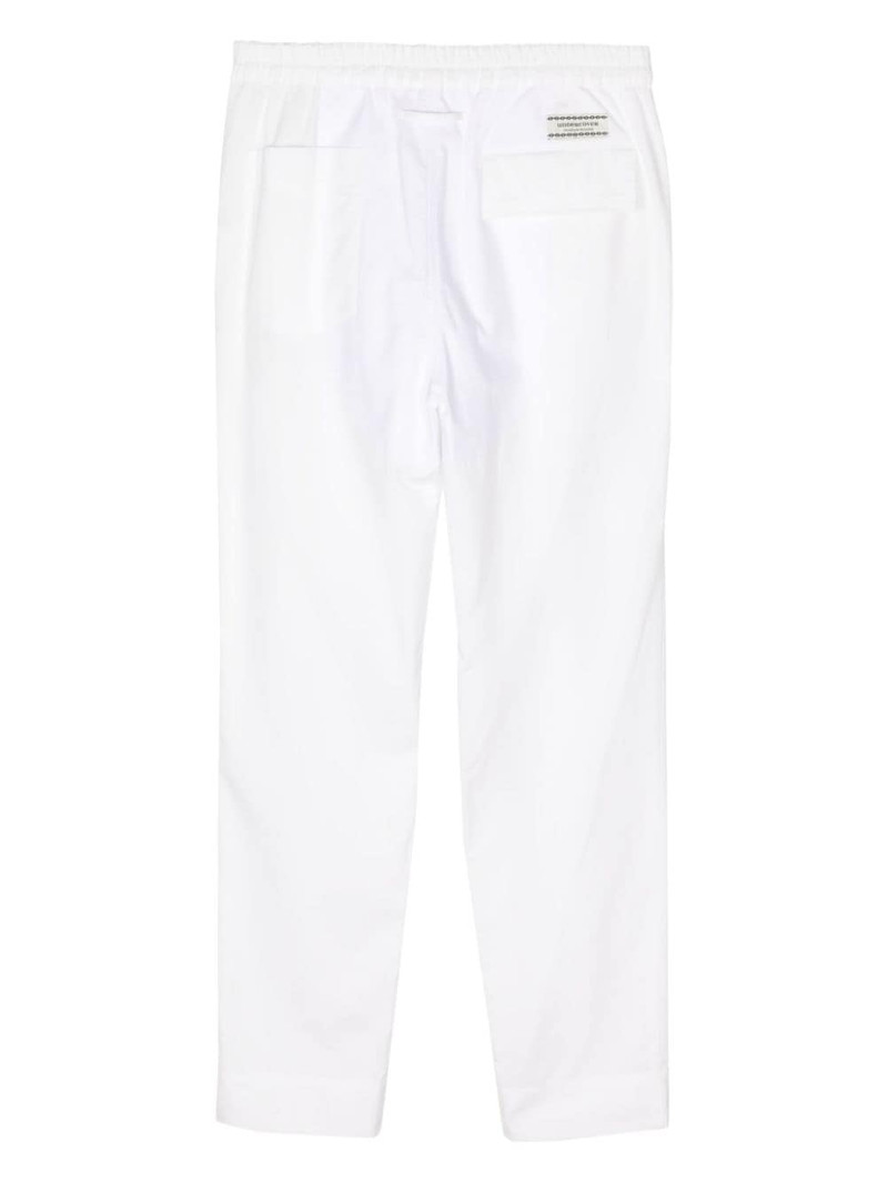UNDERCOVER panelled cotton track pants outlook