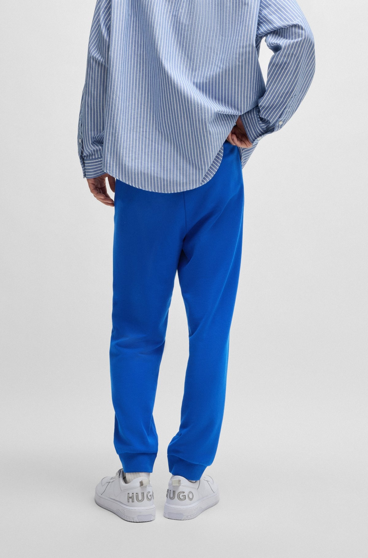COTTON-TERRY TRACKSUIT BOTTOMS WITH HAPPY HUGO LOGO PATCH - 5