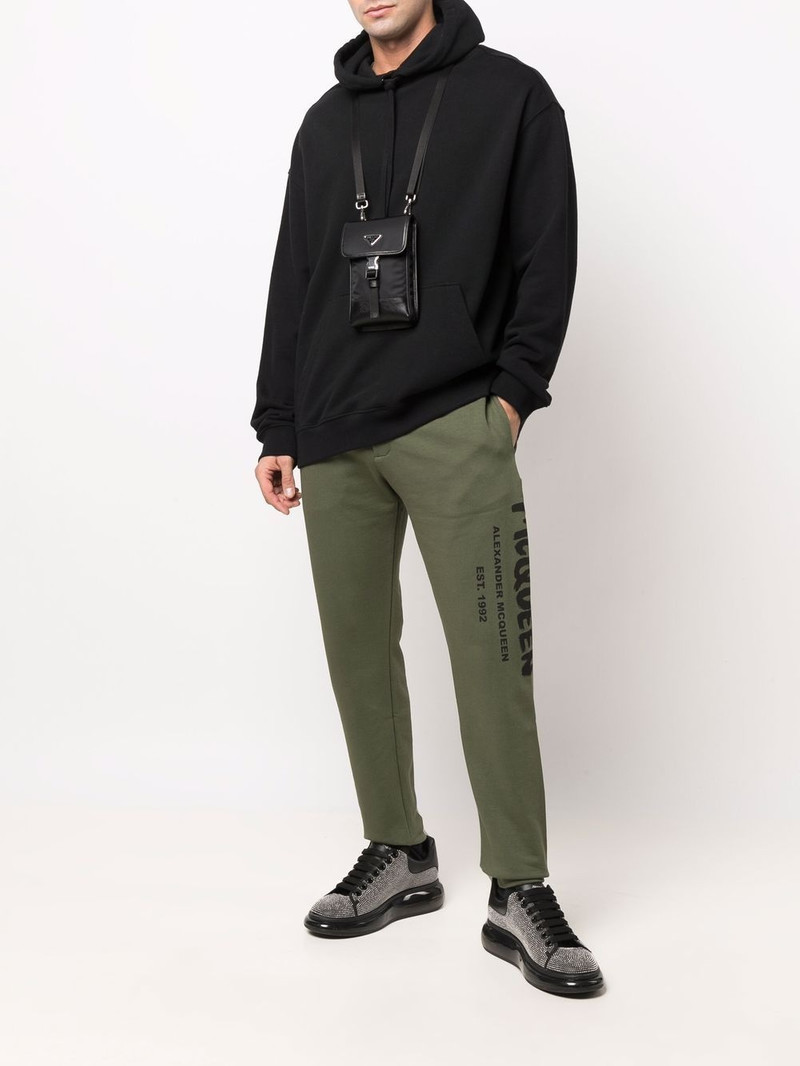 Alexander McQueen LOGO PRINT TAPERED TRACK TROUSERS outlook