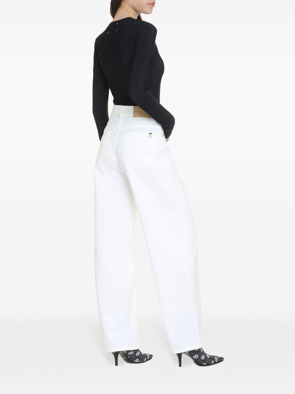 Black stretch lycra bodysuit with Four Stitches logo on the back of the neck. - 3