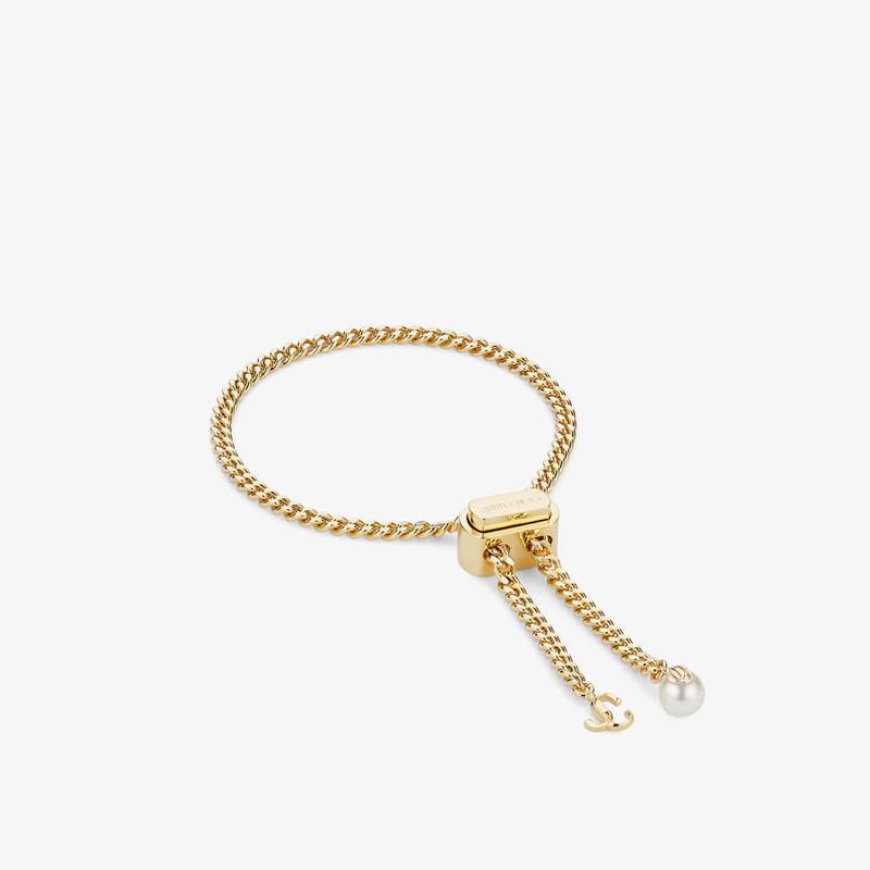 Bon Bon Bracelet
Gold-Finish Metal Bracelet with Pearl and JC Charm 6