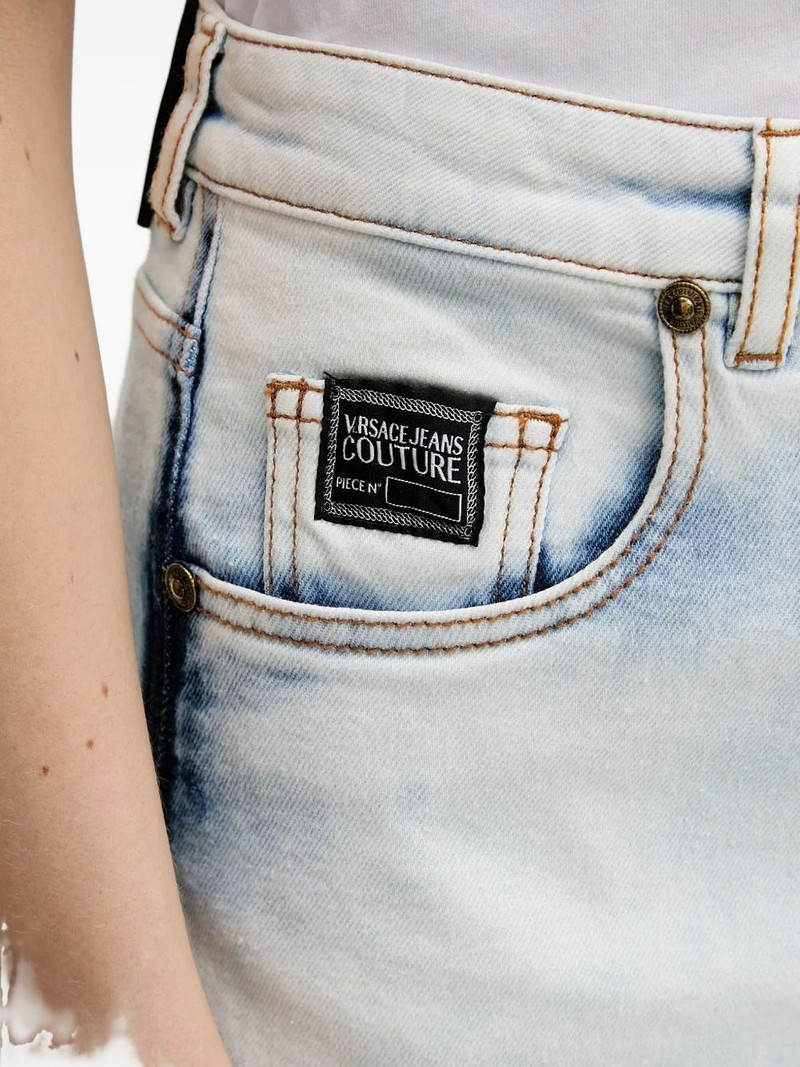 VERSACE JEANS COUTURE frayed-hem logo-patch shorts outlook