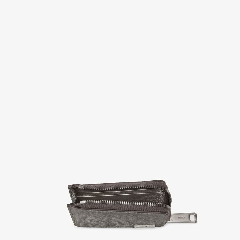 FENDI Card holder with two side zips. Made of gray Cuoio Romano leather. FF Baguette accessory in dark rut outlook