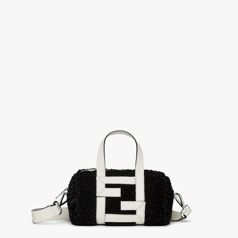 Mini bowling bag made of black sheepskin with white leather appliqués which create an FF motif. Line 1