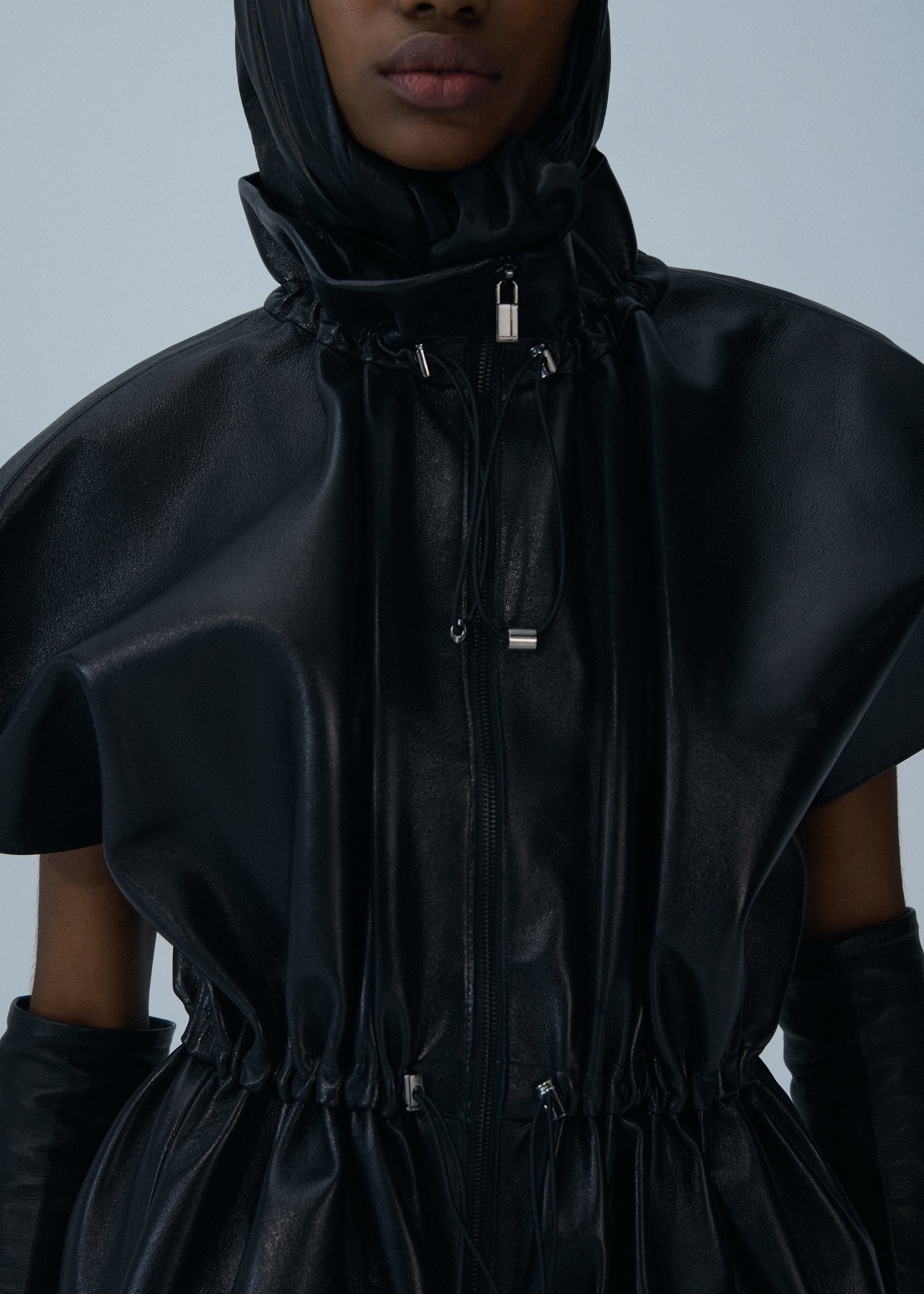 Elasticized leather peplum jacket in black - 3