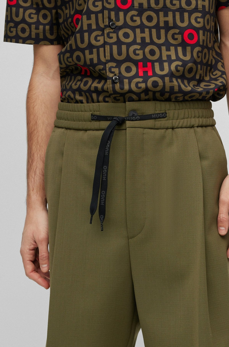 RELAXED-FIT SHORTS IN STRUCTURED PERFORMANCE-STRETCH FABRIC 5