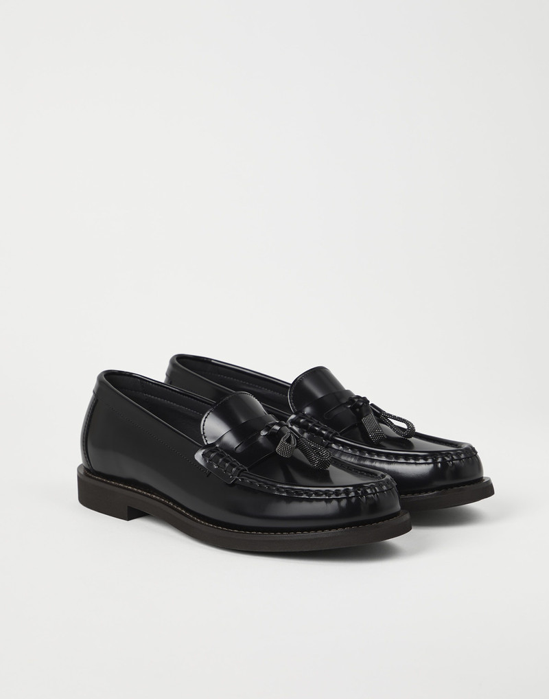 Minimal calfskin penny loafers with shiny tassels - 1