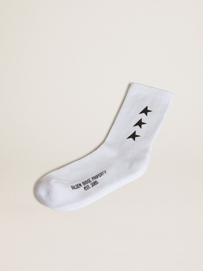 Worn white socks with contrasting black stars 1