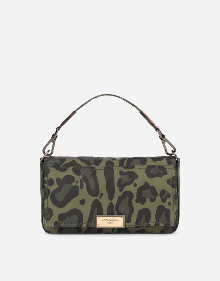 Nylon crossbody bag with leopard print against a green background and branded plate - 1