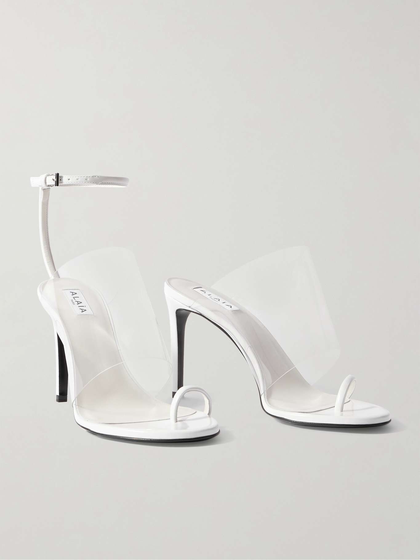 Alaïa Asymmetric patent-leather and PVC sandals White