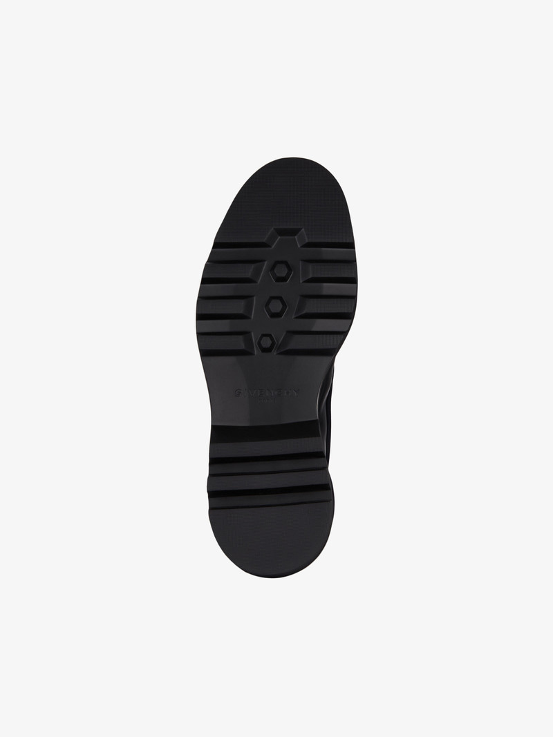 Combat boots in leather and neoprene 7