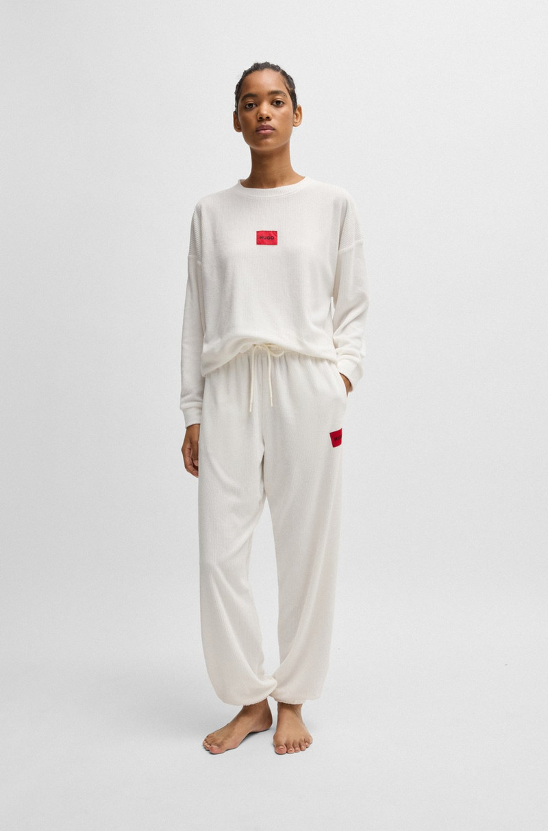 HUGO TRACKSUIT BOTTOMS WITH RED LOGO LABEL outlook