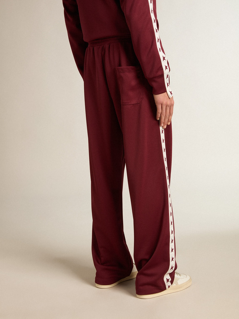 Men’s burgundy joggers with stars on the sides 4
