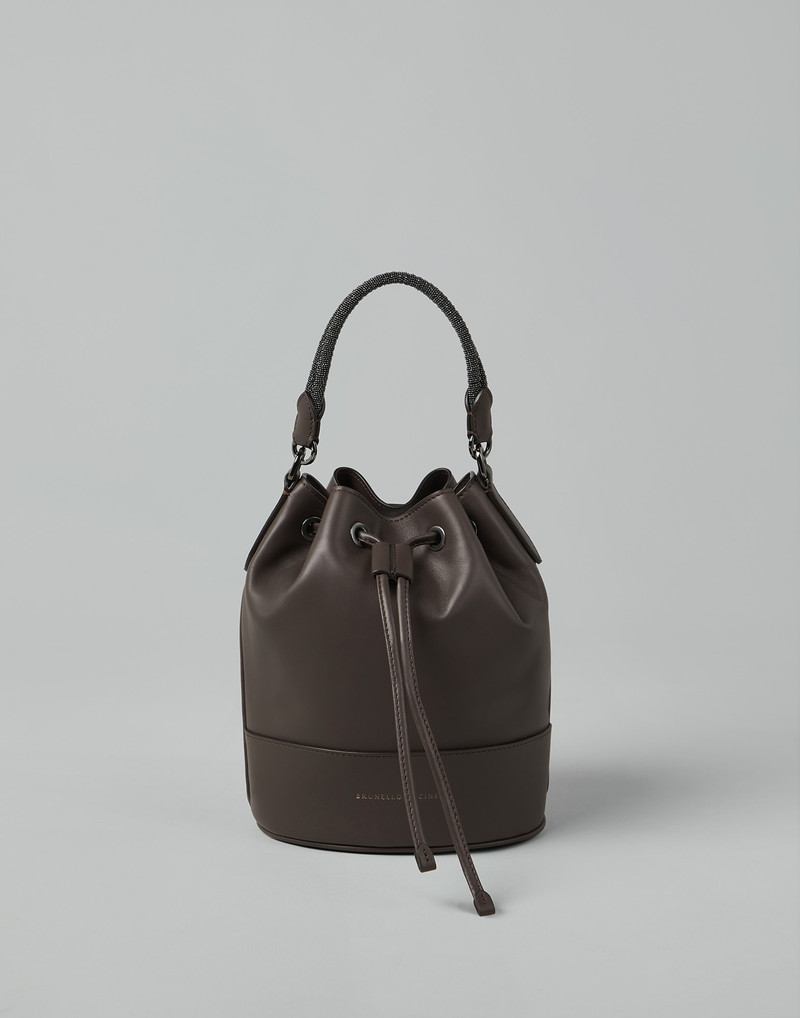 Calfskin bucket bag with precious braided handle 1