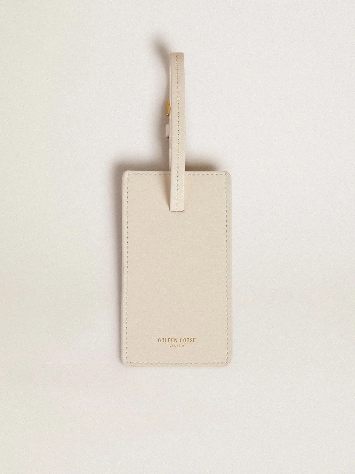Worn white luggage tag - 1