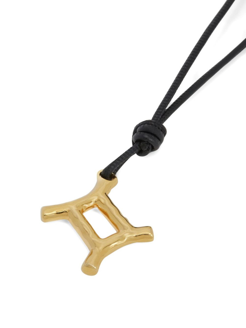 Jil Sander zodiac-pendant bag charm outlook