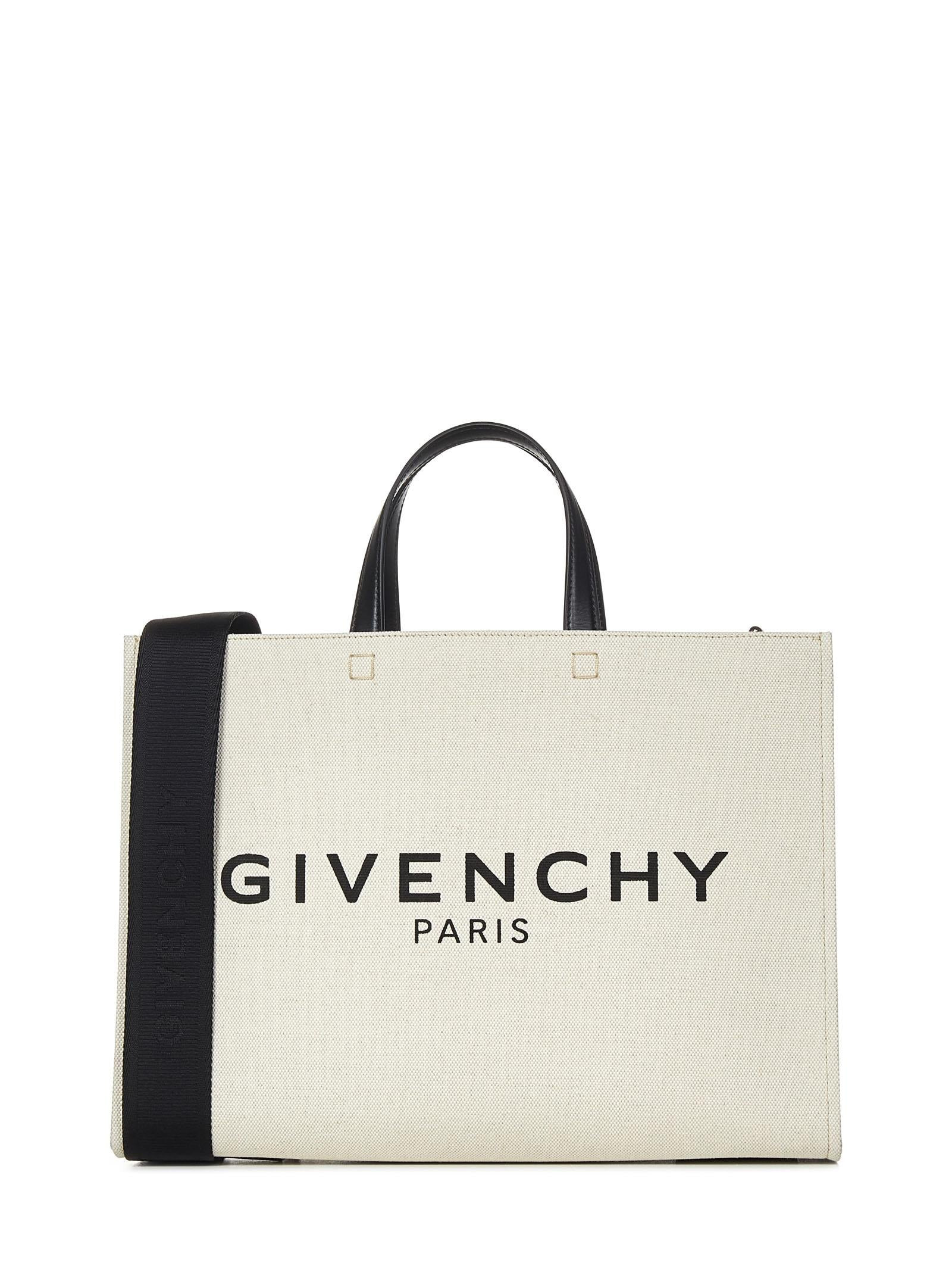 Beige cotton and linen canvas tote bag with signature at front and removable shoulder strap. - 1