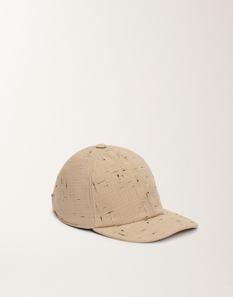 Baseball cap in buttoned tailoring 1