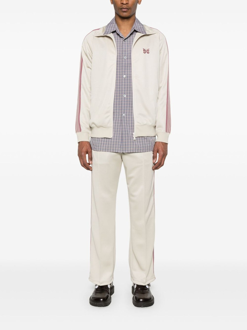 NEEDLES butterfly-embroidered track pants outlook