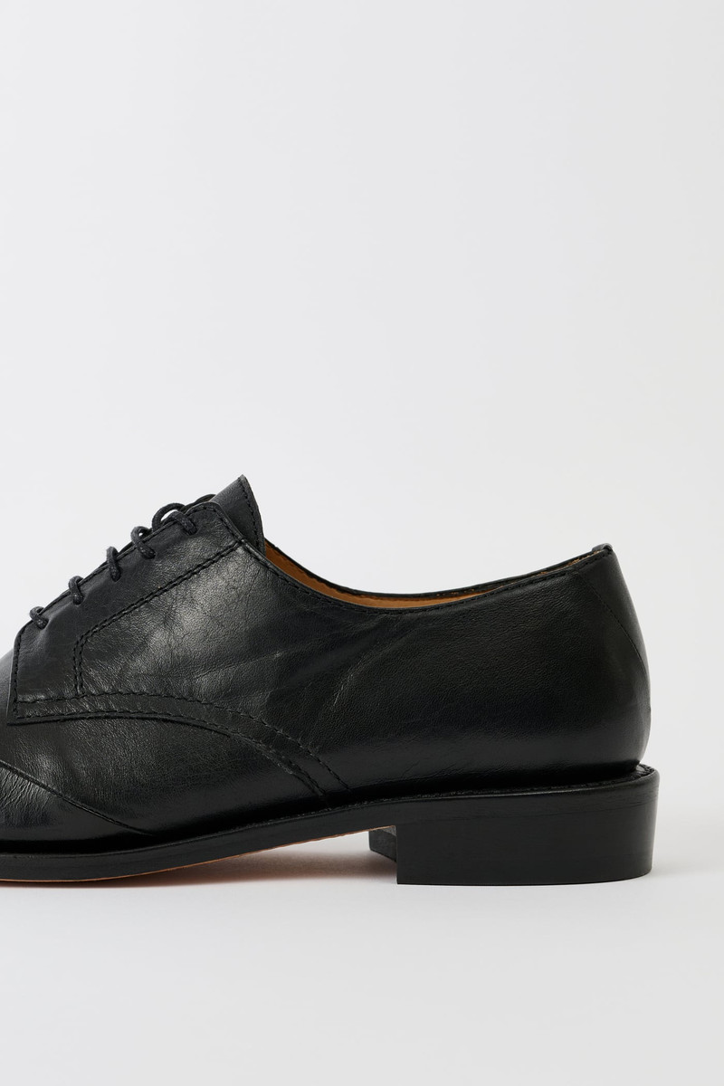 Patched Parade Malleable Black Bull Hide 3