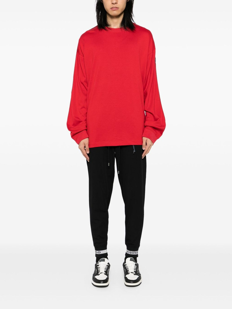 MASTERMIND WORLD logo print track pants outlook