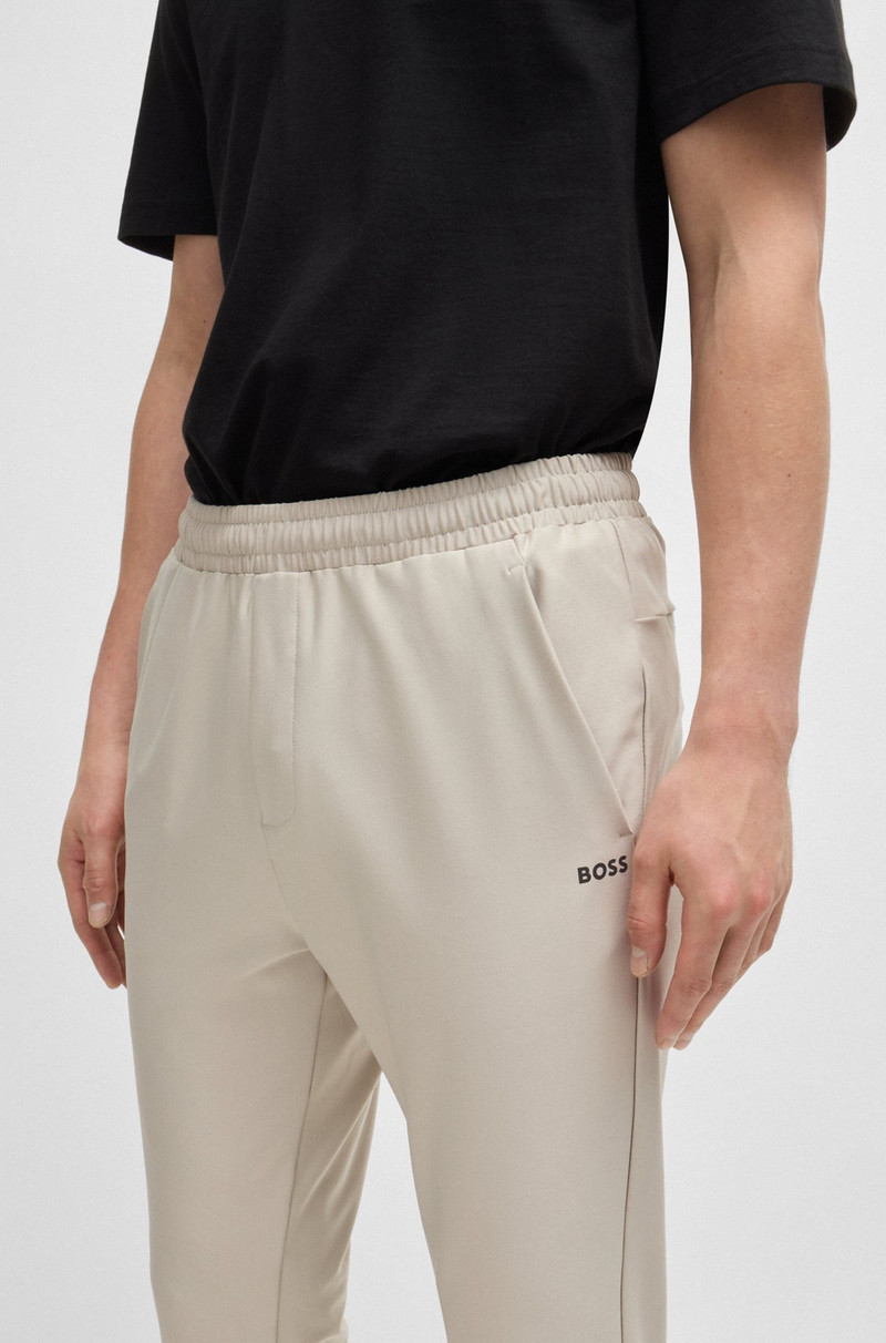 TRACKSUIT BOTTOMS IN STRETCH FABRIC WITH DECORATIVE REFLECTIVE LOGO 3