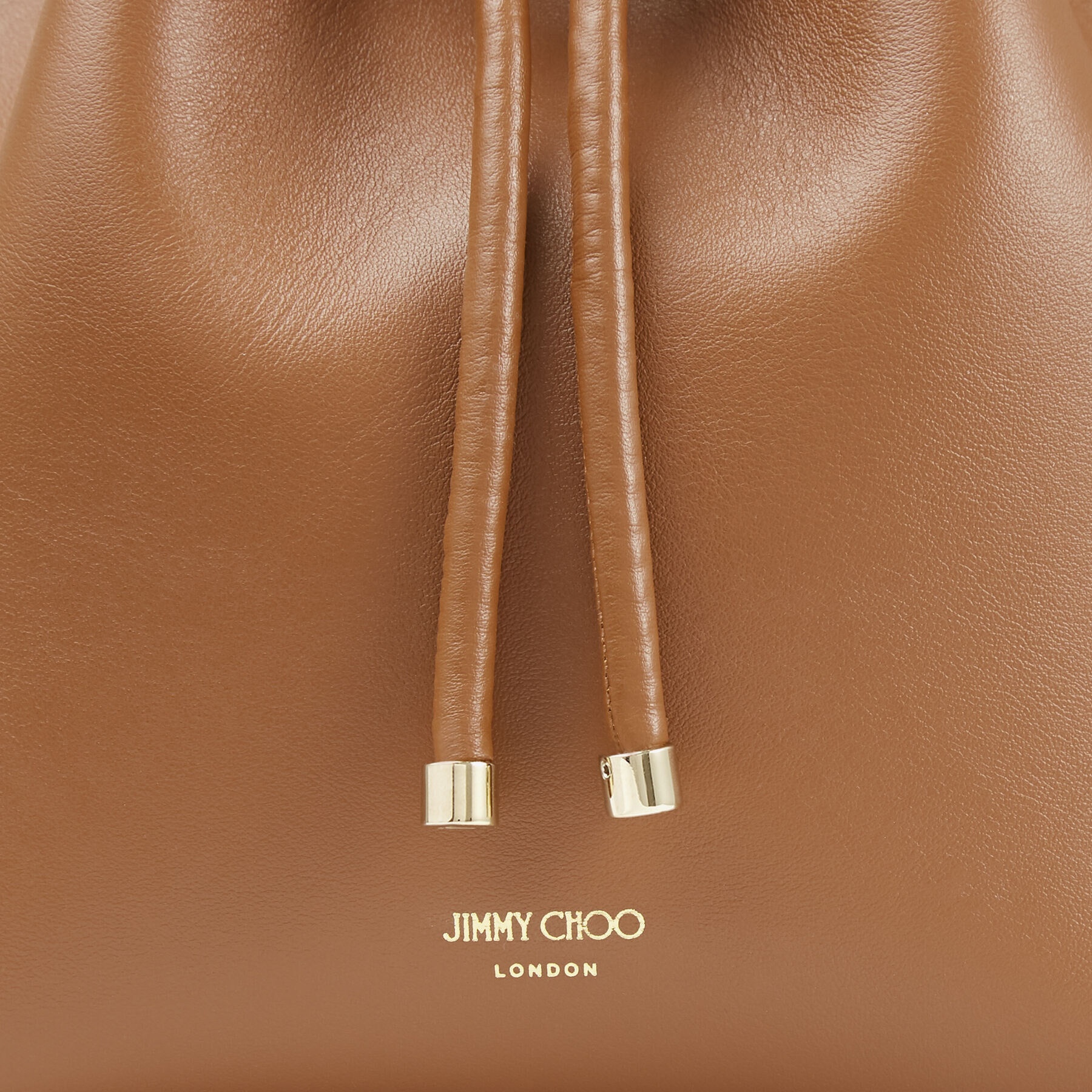 Bon Bon Bucket
Dark Tan Calf Leather Bag with Light Gold Metal Handle - 6