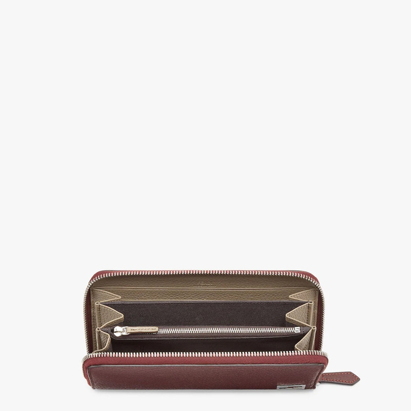 FENDI Wallet with zip. Organized into three gusseted compartments with eight card slots and a zip pocket.  outlook