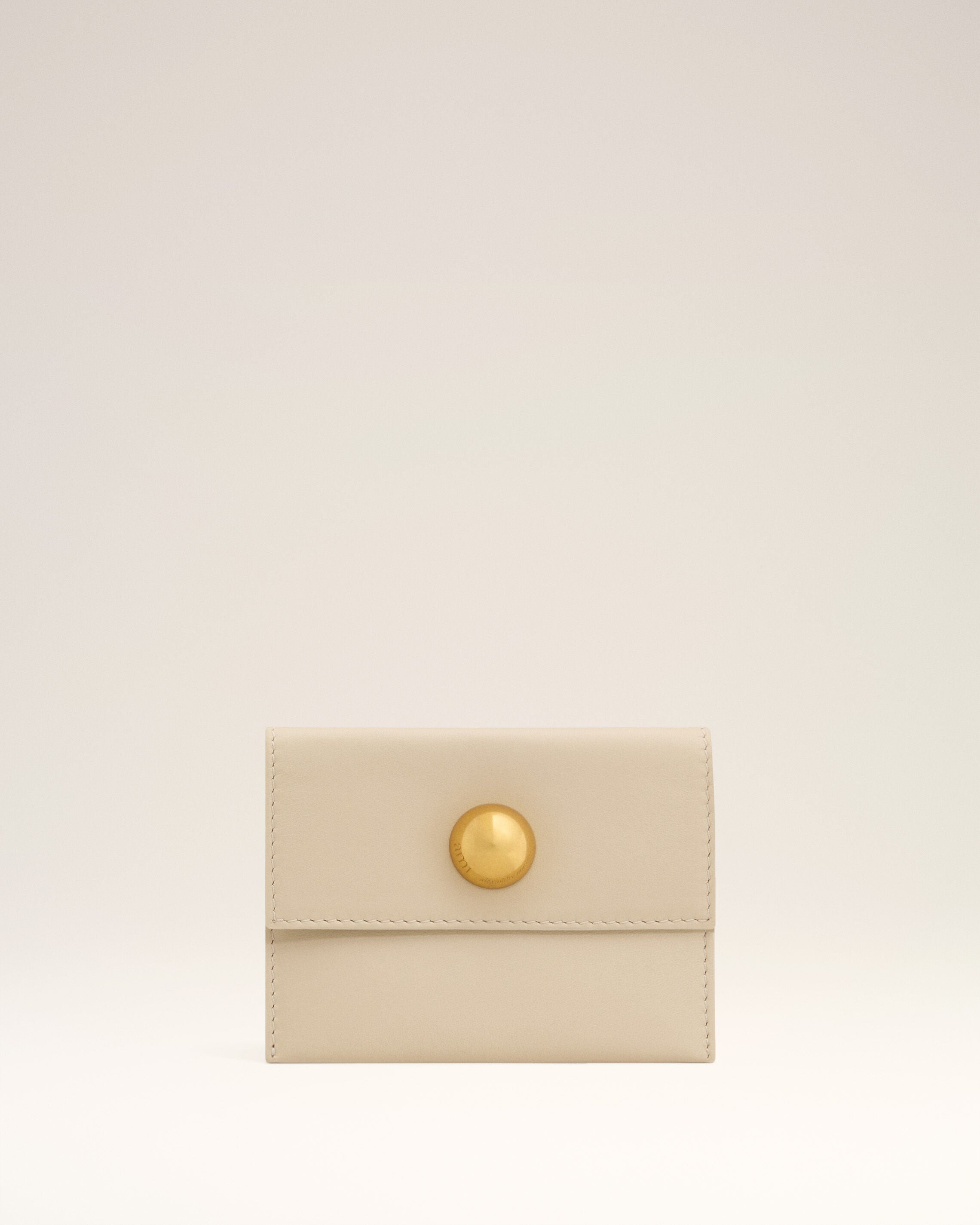 BEIGE LEATHER CARROUSEL FOLDED CARD HOLDER - 1