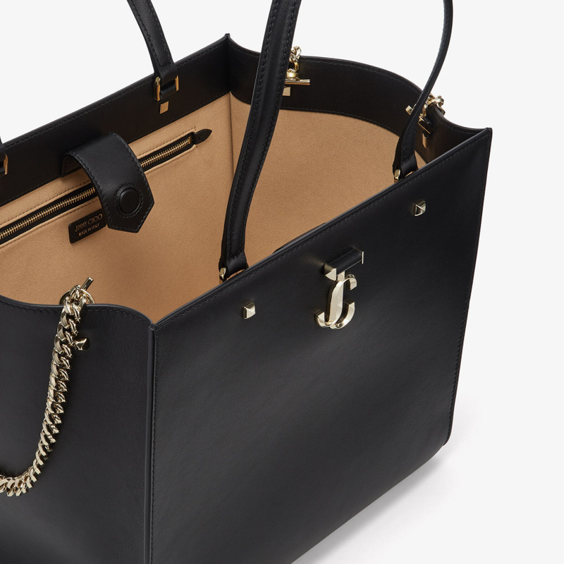 Varenne Tote Bag
Black Fine Shiny Calf Leather Tote Bag with Light Gold JC Emblem 4
