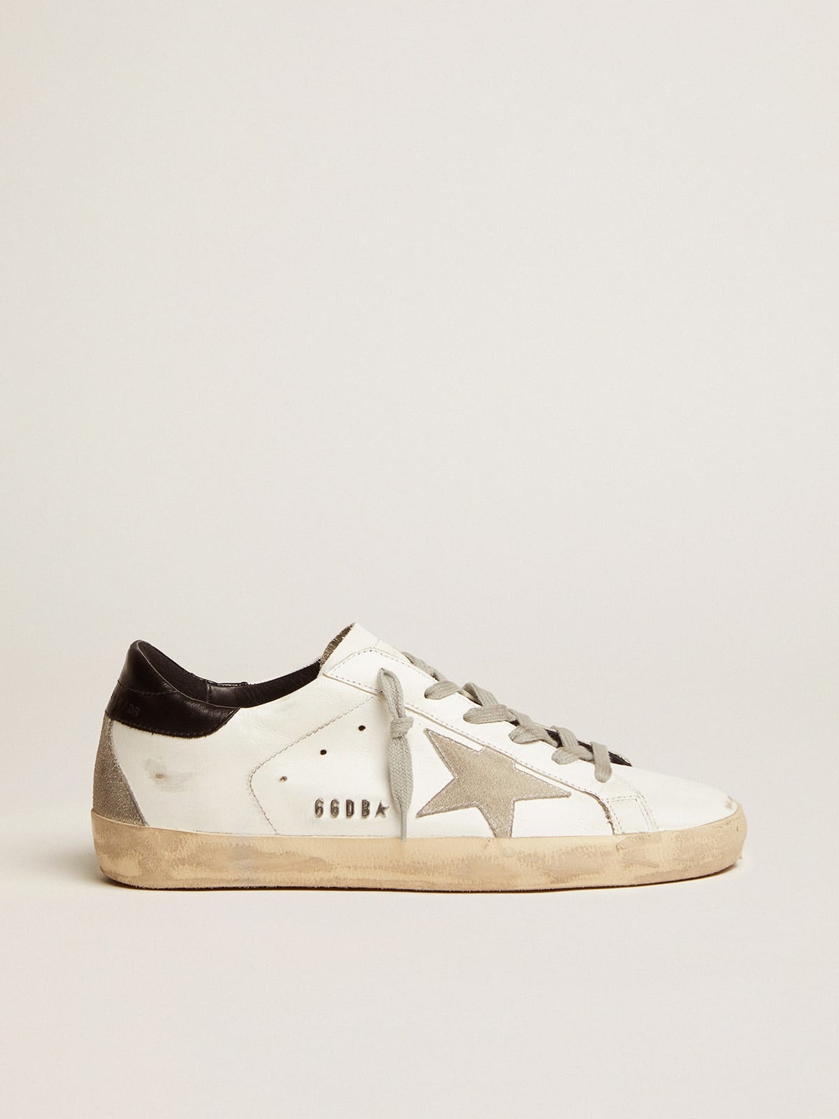 Golden Goose Women\'s Super-Star sneakers with black heel tab and metal stud  lettering | goldengoose | REVERSIBLE