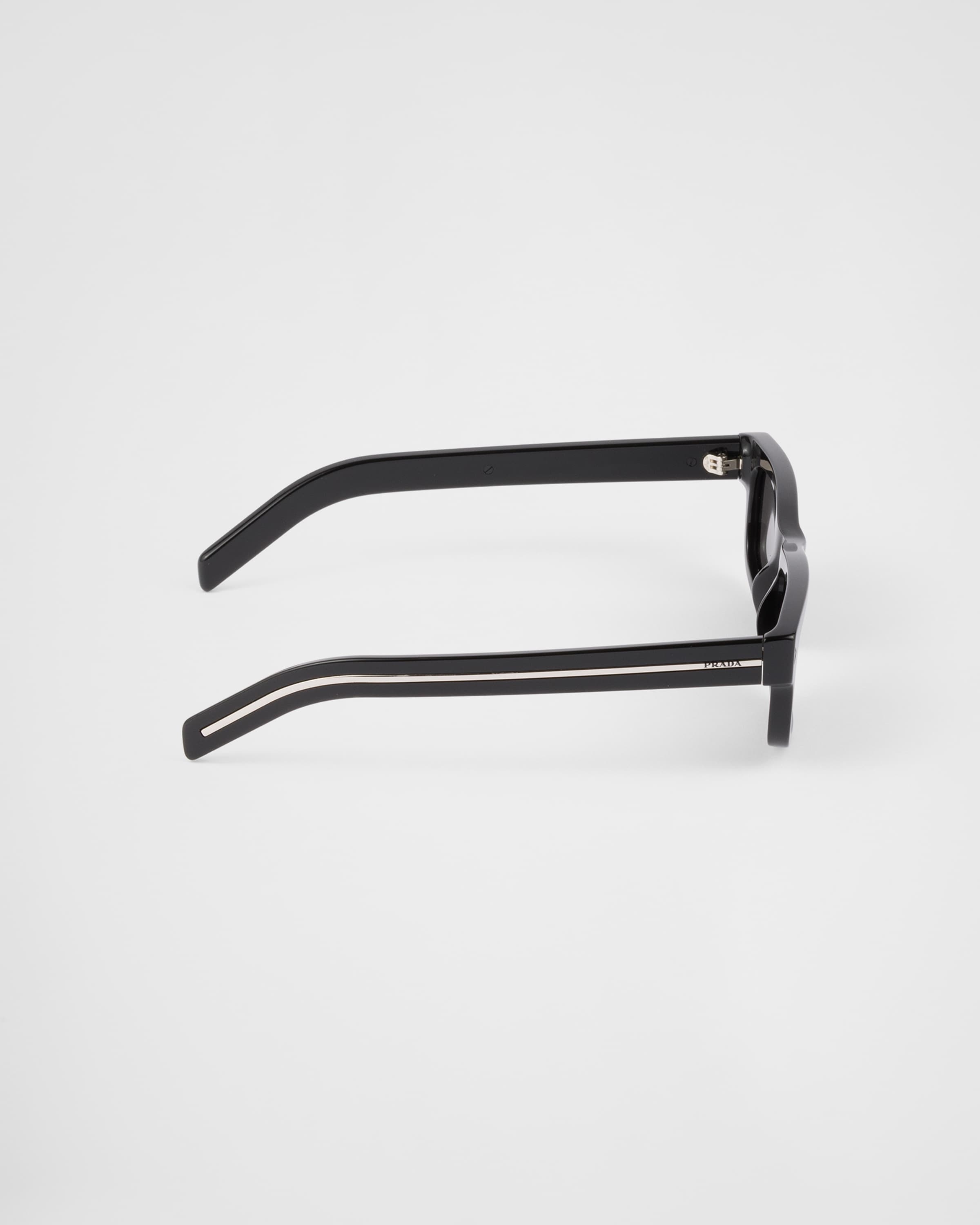 Prada Sunglasses with the iconic metal plaque | REVERSIBLE