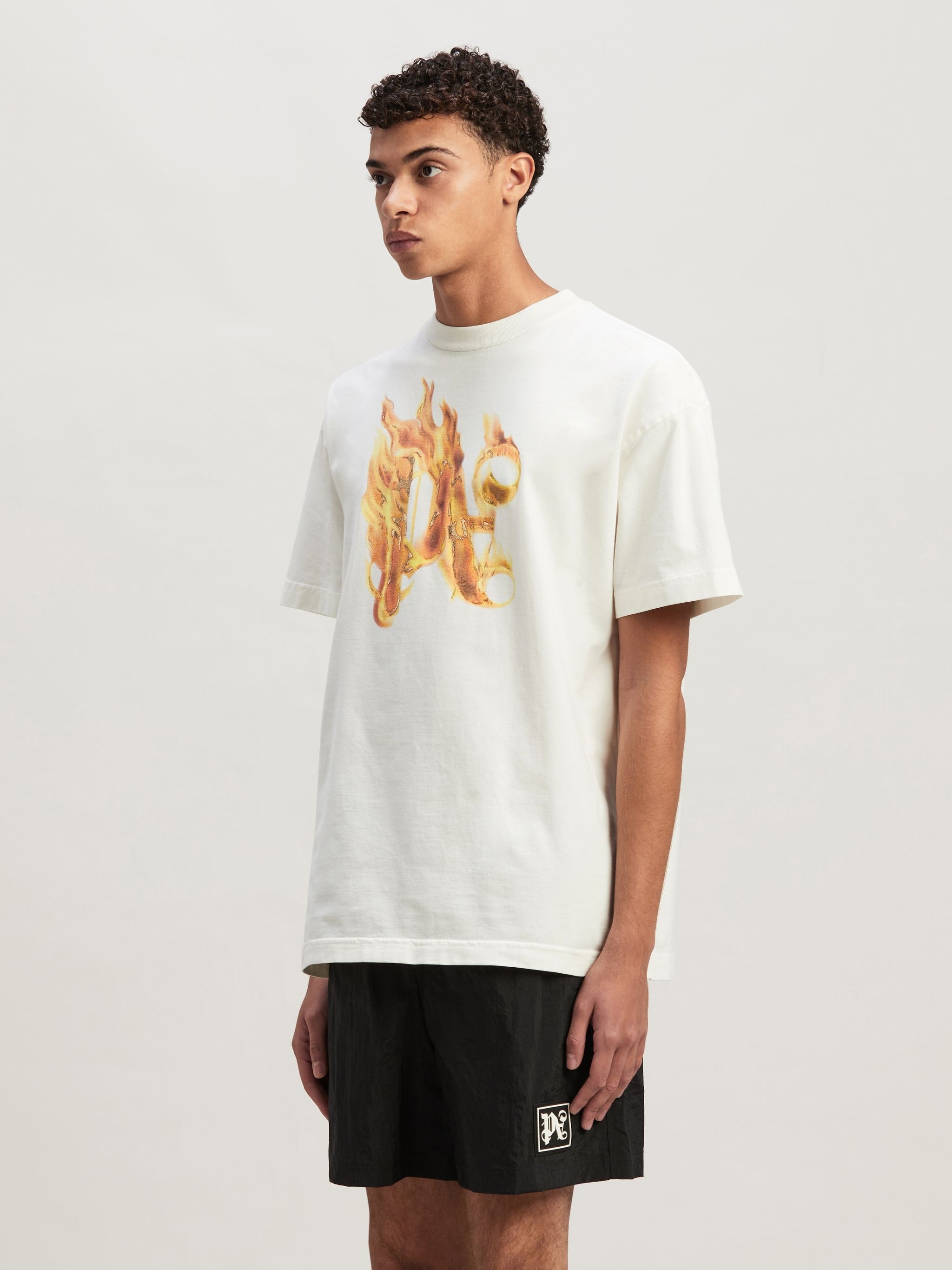 唯一無二の個性を纏う【Palm Angels】BURNING MONOGRAM T-SHIRT Palm Angels Burning monogram-print T-shirt | Black | FARFETCH