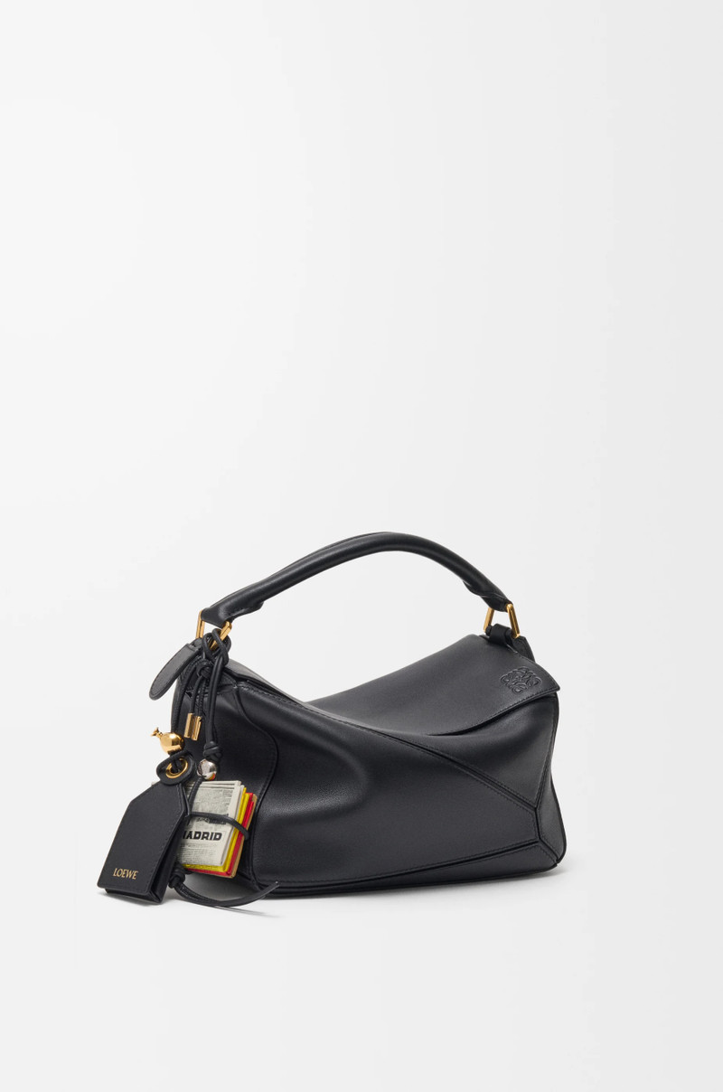 Newspaper charm in calfskin 3