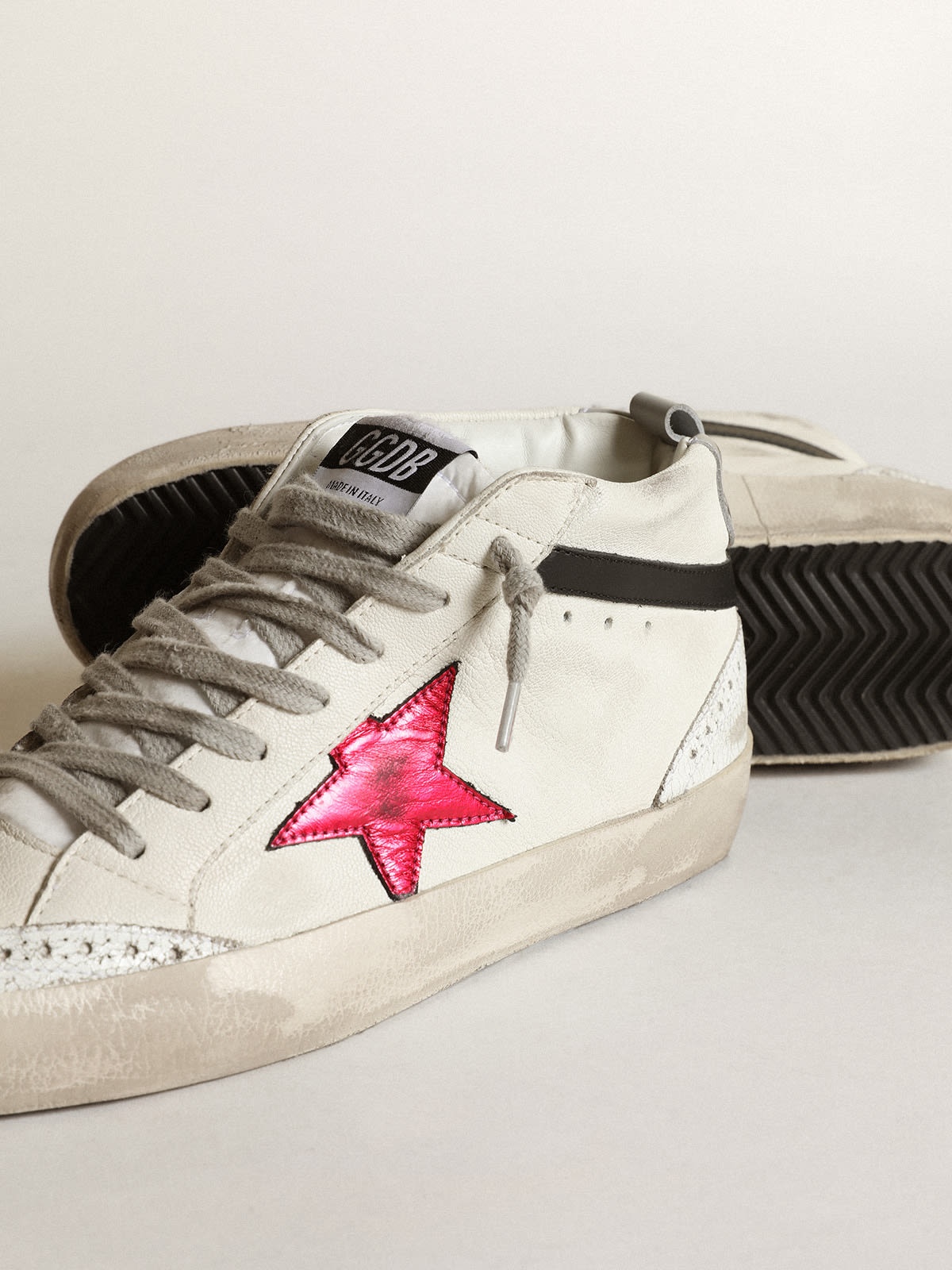 Mid Star with a pink laminated leather star and black flash - 4