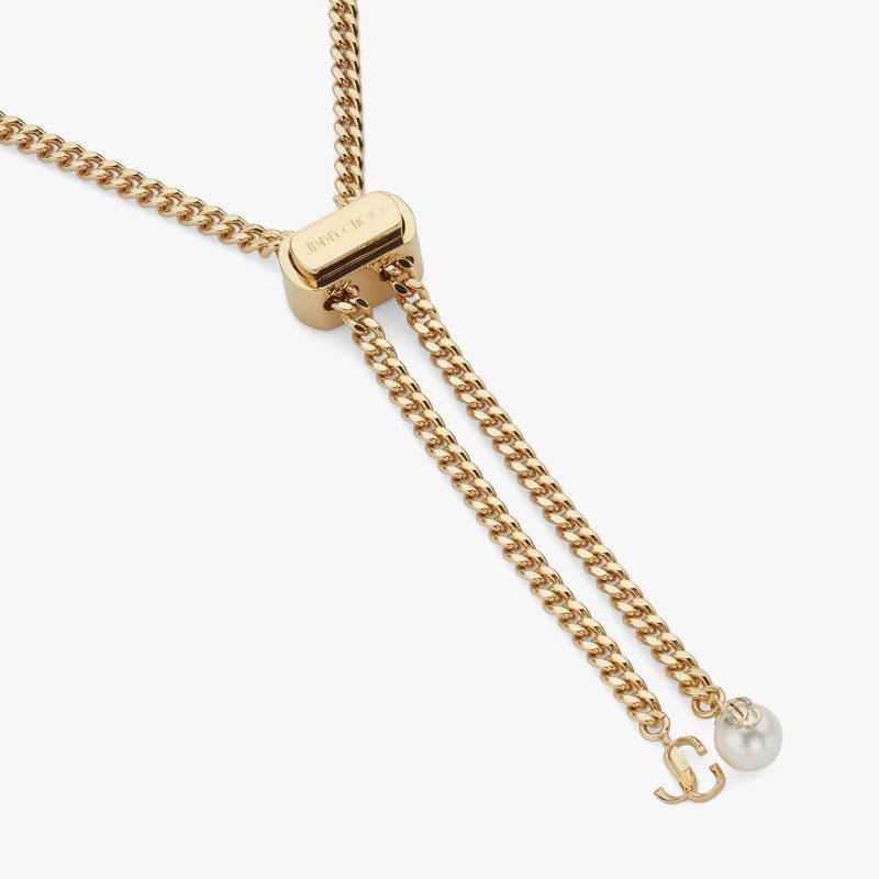 Bon Bon Necklace
Gold-Finish Metal Necklace with Pearl and JC Charm 4