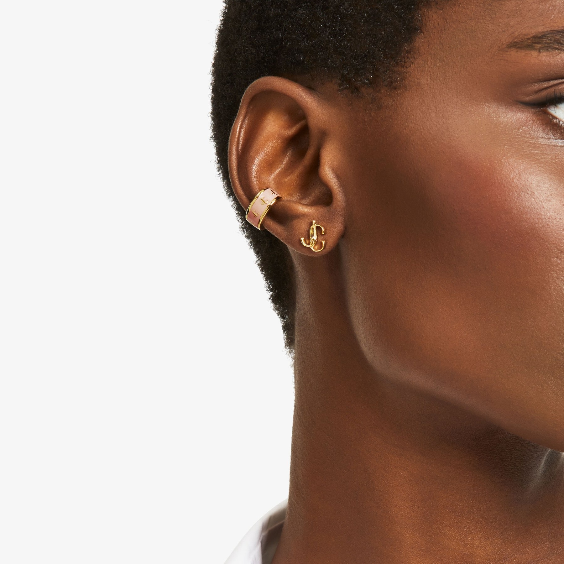 Single JC Ear Cuff
Gold-Finish Metal and Latte Enamel JC Ear Cuff - 2